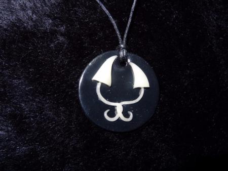 Pendentif psylos phosphorescents entrelacés en pâte polymère